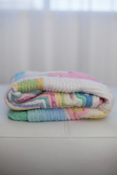 baby cot blanket made of recycled wool scraps. All pastel colors. French knitted art